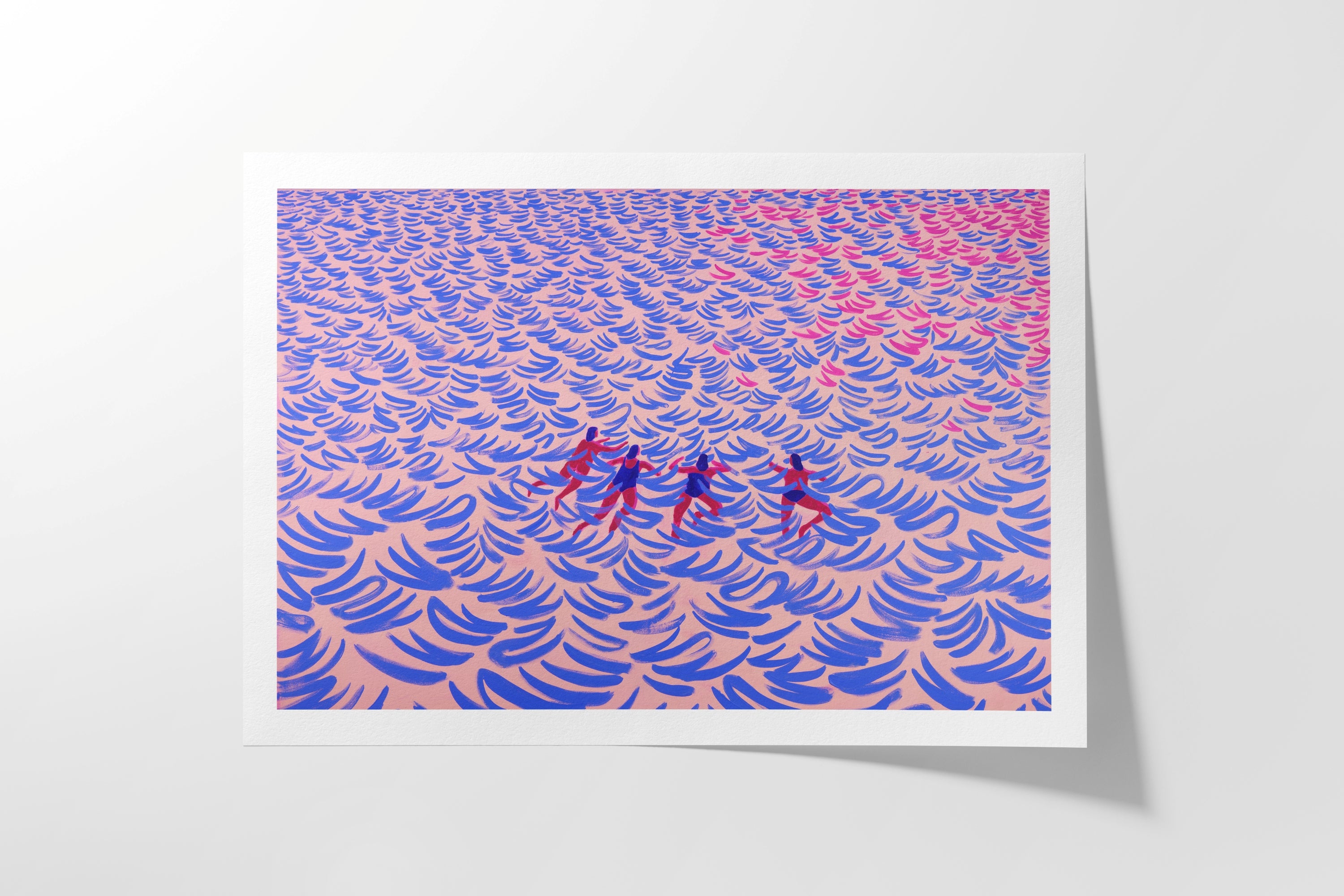 A art print with a white border, featuring  waves with four small red figures in the center, displayed against a light gray background