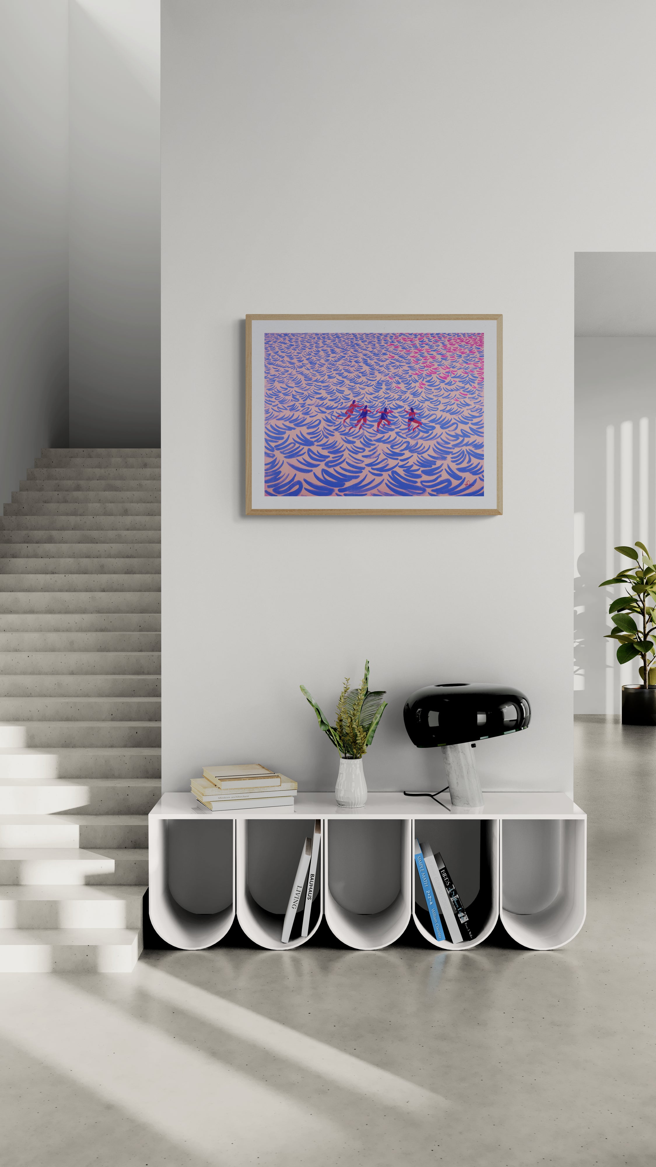 A framed art print by fabian lavater featuring peaple swimming in ocean hangs on a white wall in a modern minimalist hallway