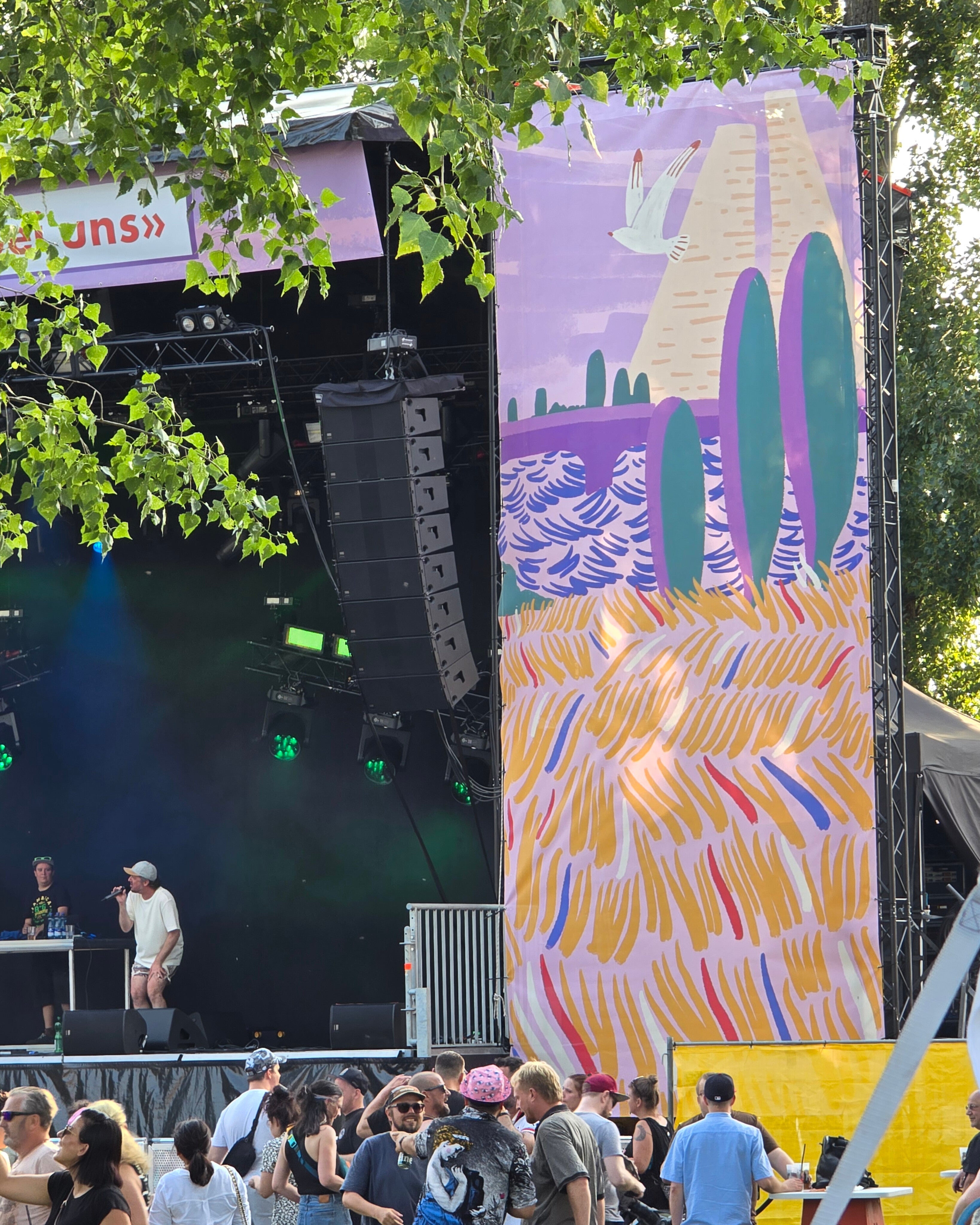 Stage with a colorful abstract mural by fabian lavater