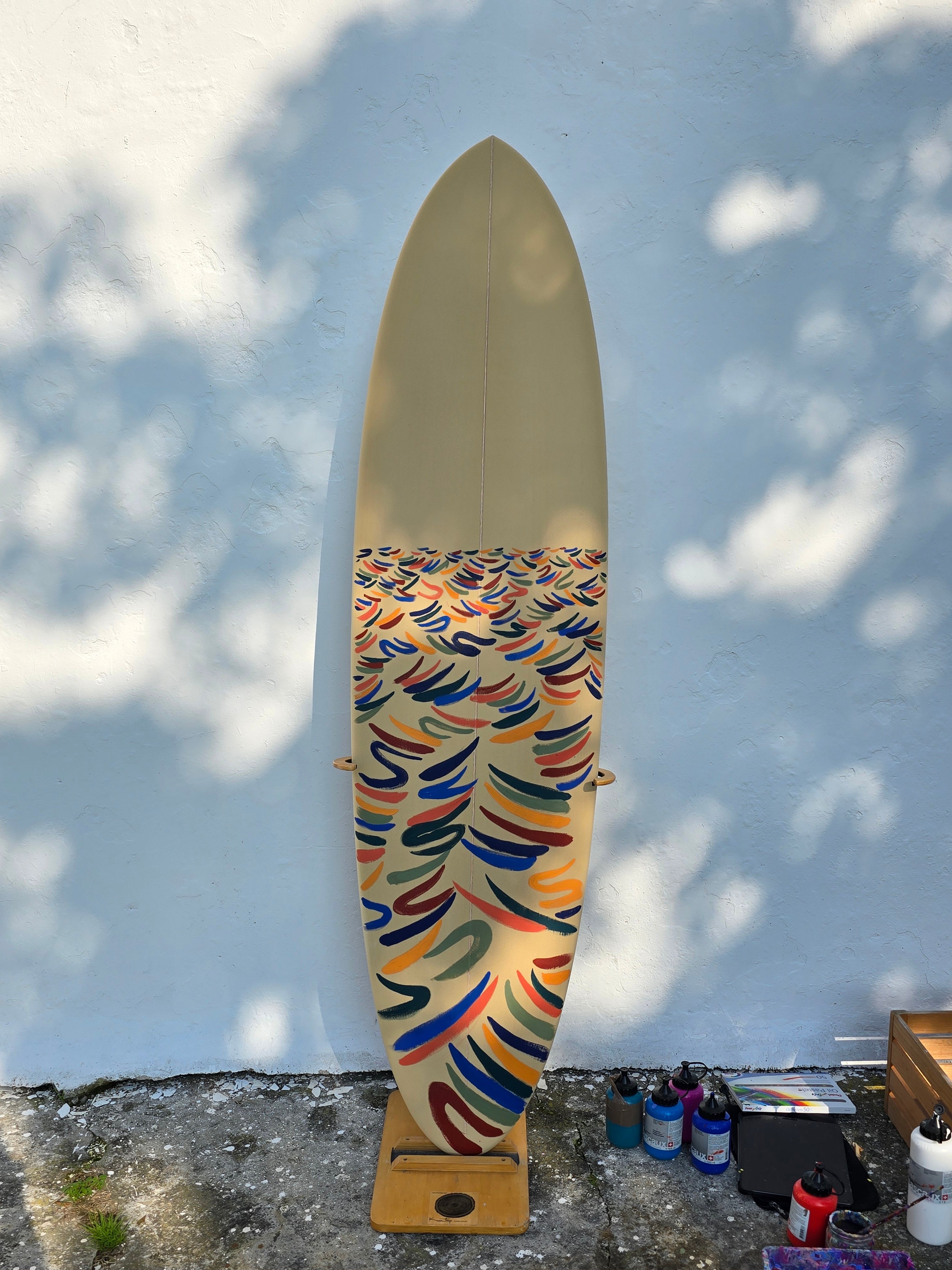 Colorful surfboard with abstract pattern designed by Fabian Lavater