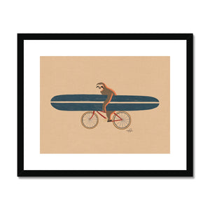 Sloth riding a bike holding a surfboard Framed & Mounted Print